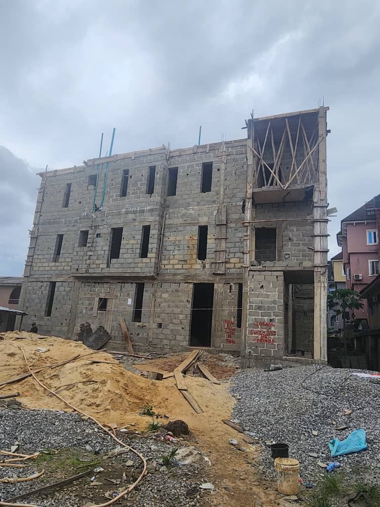 Multi-storey blockwork shell with roof framing on top